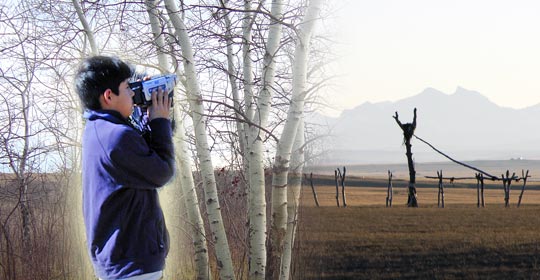 Bryce shooting video. Poplar poles support the cottonwood in the Sundance Lodge. (Photo courtesy of Narcisse Blood)